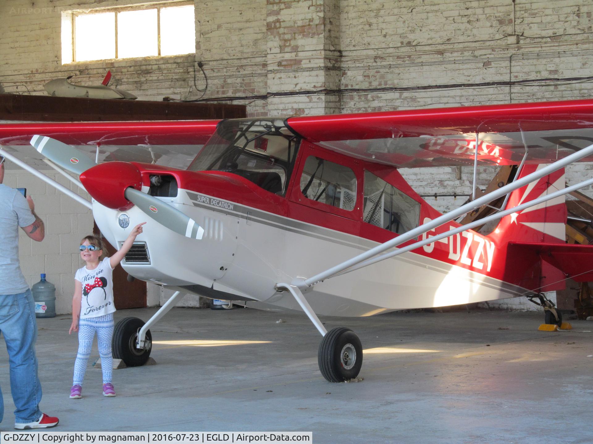 G-DZZY, 2011 American Champion 8KCAB Super Decathlon C/N 1106-2011, in hangar at denham