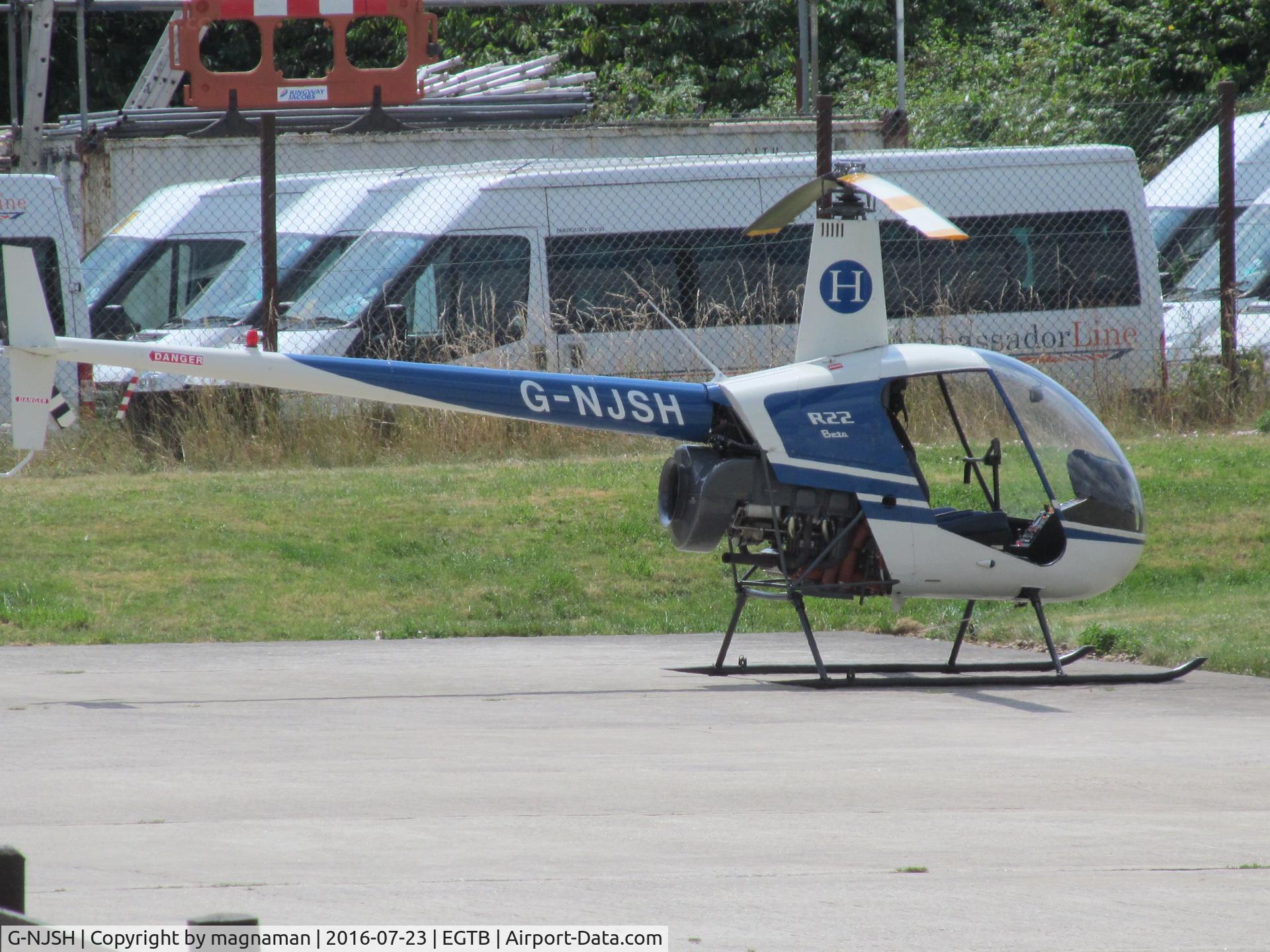 G-NJSH, 1988 Robinson R22 Beta C/N 0780, on apron at booker