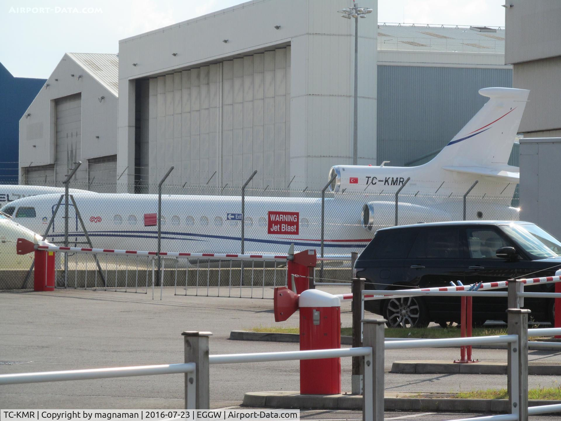 TC-KMR, Dassault 7X C/N 254, across car park at luton