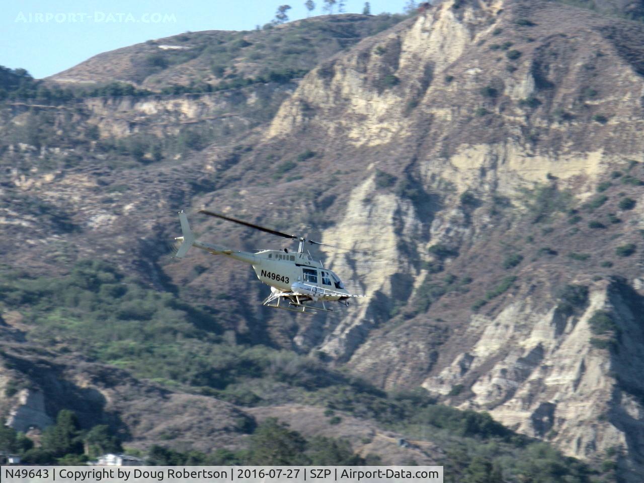 N49643, 1975 Bell 206B JetRanger C/N 1813, 1975 Bell 206B JETRANGER, one Allison 250-C20 turboshaft 420 shp for takeoff, 370 shp continuous, Restricted class with spray booms, ag applicator returning to OXR base via Santa Clara River route past SZP.