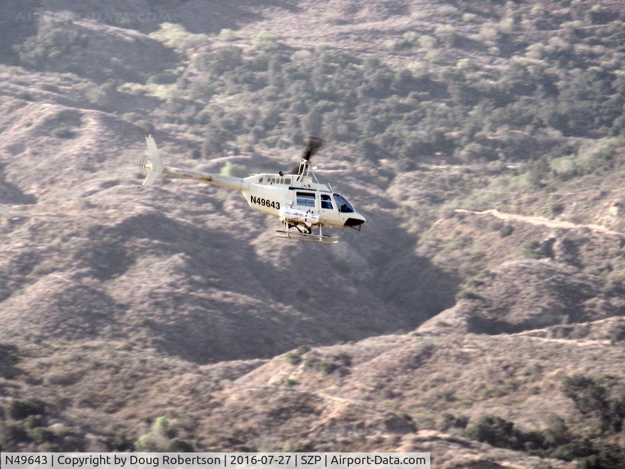 N49643, 1975 Bell 206B JetRanger C/N 1813, 1975 Bell 206B JETRANGER, one Allison 250-C20 turboshaft 420 shp for takeoff, 370 shp continuous, Restricted class with spray booms, ag applicator returning to OXR base via Santa Clara River route past SZP.