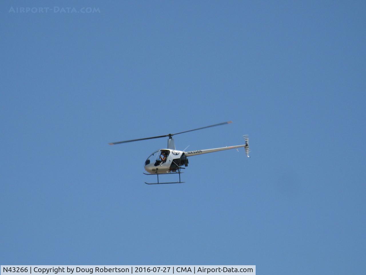 N43266, 1990 Robinson R22 Beta C/N 1268, 1990 Robinson R22 BETA, Lycoming O-320-B2C, approach to land on Orbic's ramp near Control Tower