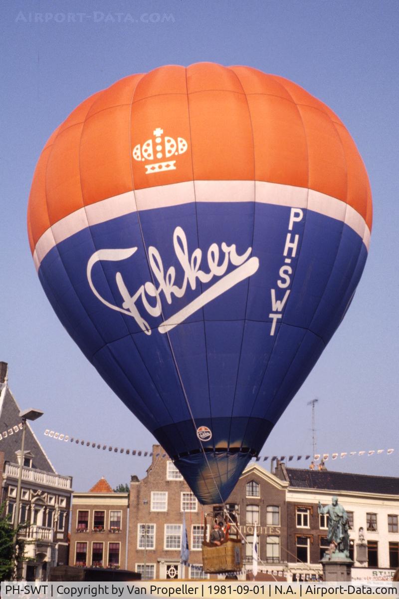 PH-SWT, 1980 Thunder AX6-56 Z C/N 328, Thunder AX6-56Z owned by Fokker inflated on the Grote Markt in the center of Haarlem in the Netherlands. This was as high as it got. This was part of the commemoration of the flying demonstration by Anthony Fokker in his Spider above Haarlem in 1911.