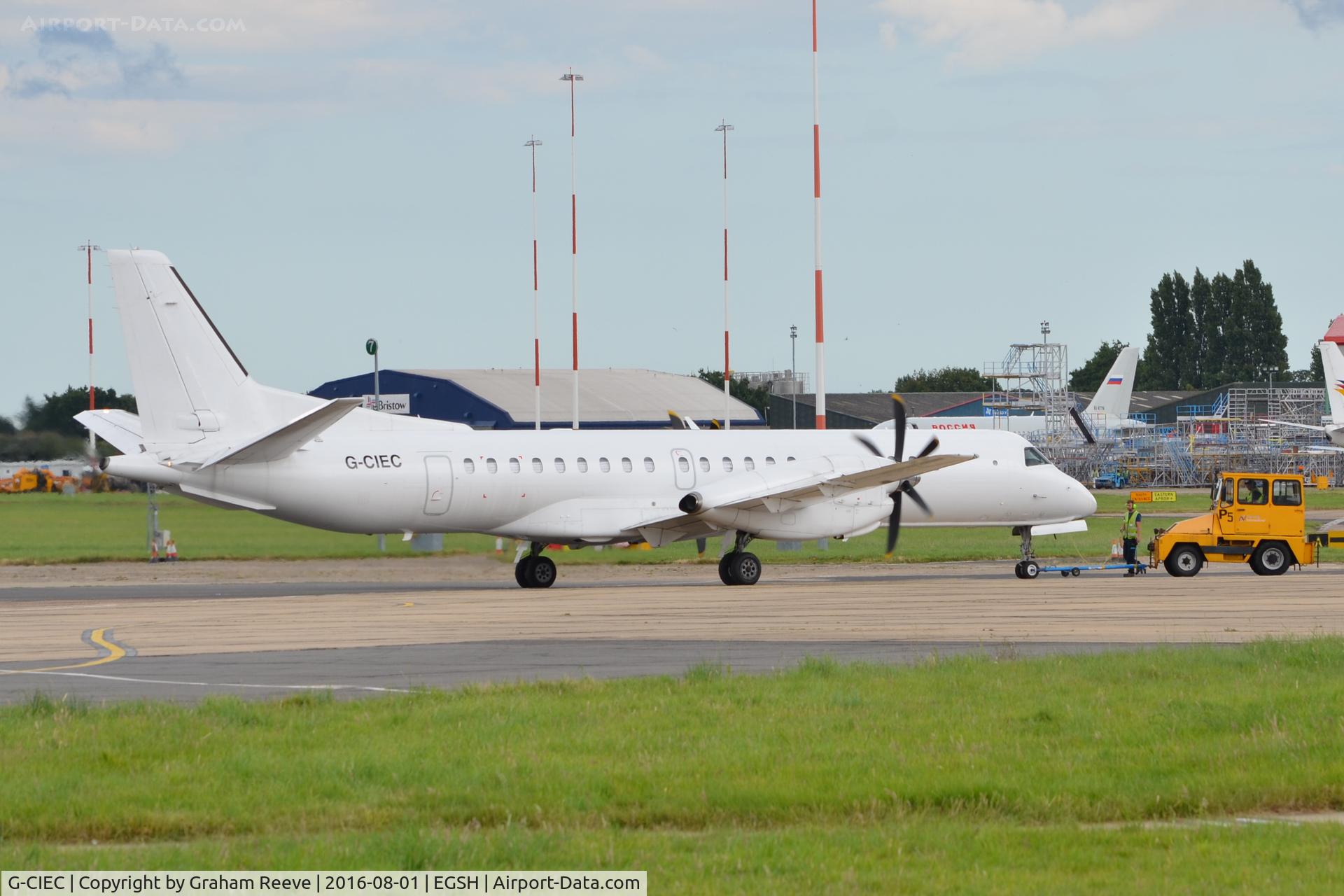 G-CIEC, 1996 Saab 2000 C/N 2000-037, Being pushed back from the stand.