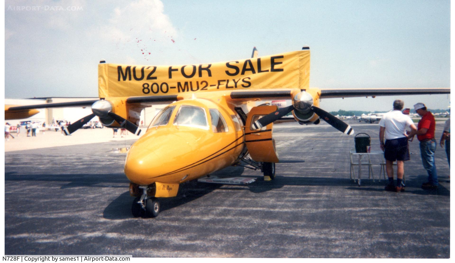 N728F, 1967 Mitsubishi MU-2B C/N 019, Mr Magoo front shot with sales banner. about 1983?