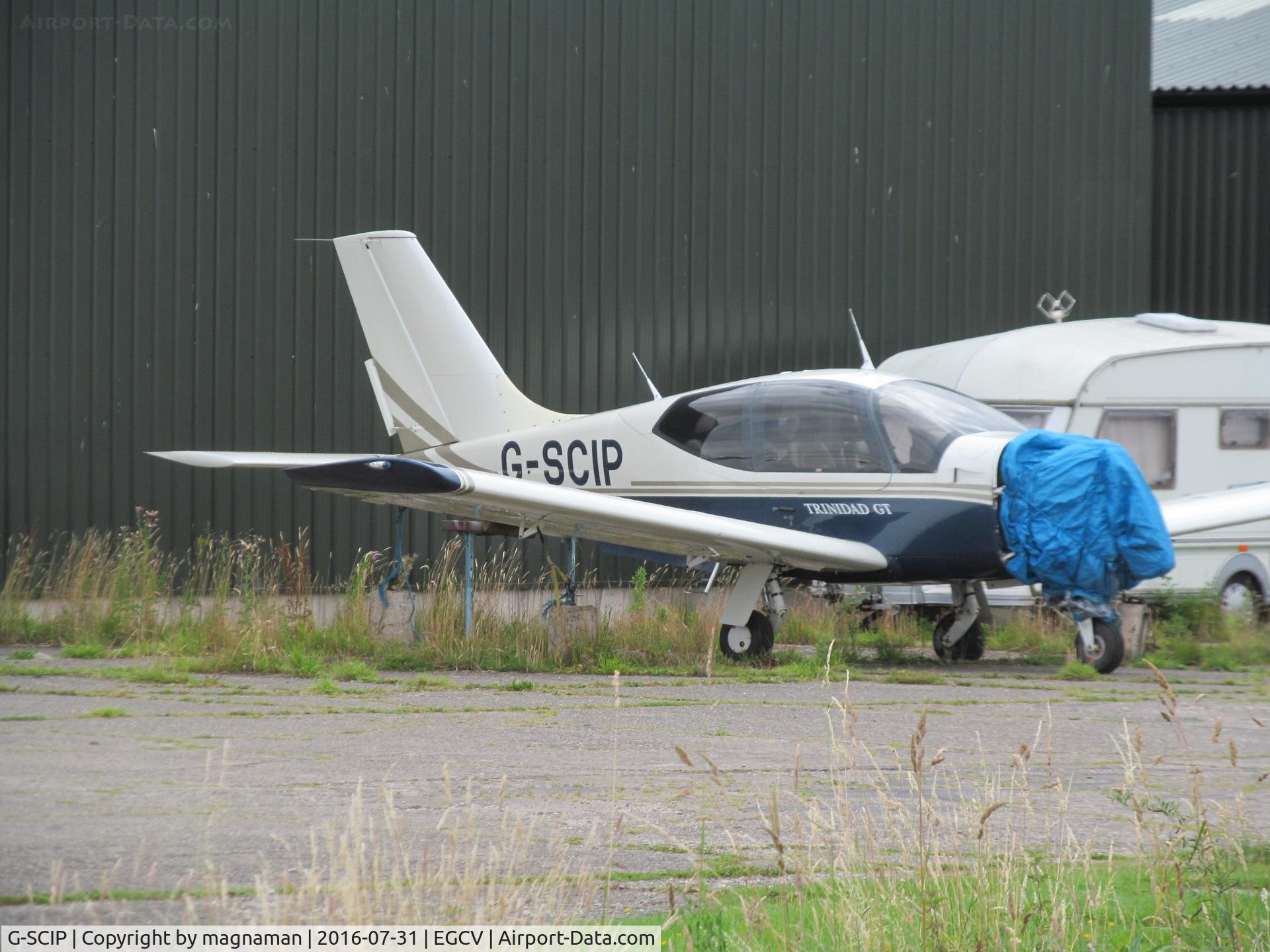 G-SCIP, 2000 Socata TB-20 Trinidad C/N 2014, among hangars at sleap