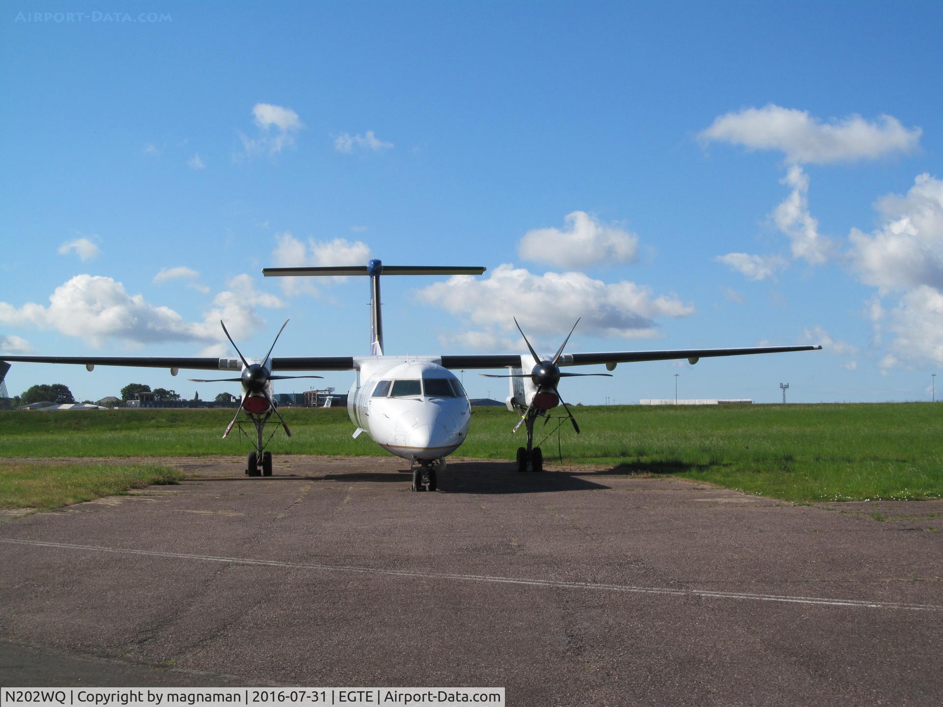 N202WQ, 2008 De Havilland Canada DHC-8-402 Dash 8 C/N 4202, Not quite central as I was driving along taxiway at the time!