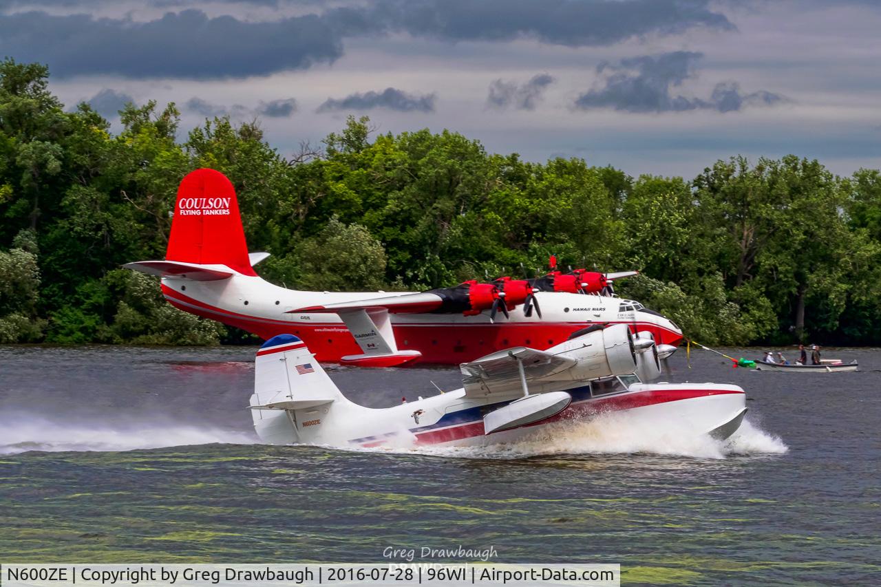 N600ZE, 1943 Grumman G-21A Goose C/N B-100, Grumman Goose N600ZE on the takeoff run past Coulson Flying Tankers Martin Mars at the EAA Seaplane Base in Oshkosh, WI