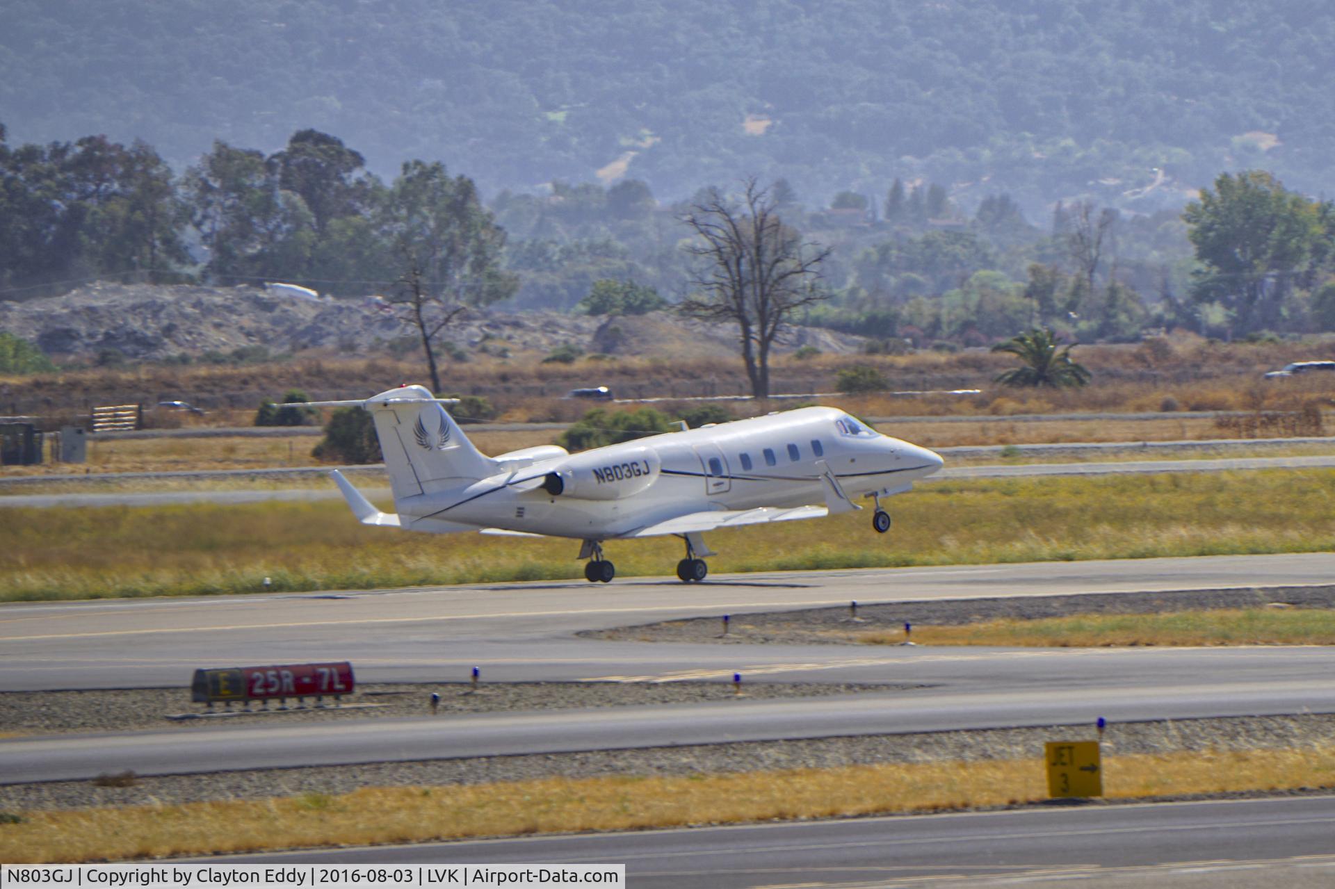 N803GJ, 2013 Gates Learjet 55 C/N 115, Departing Livermore Airport. 2016.