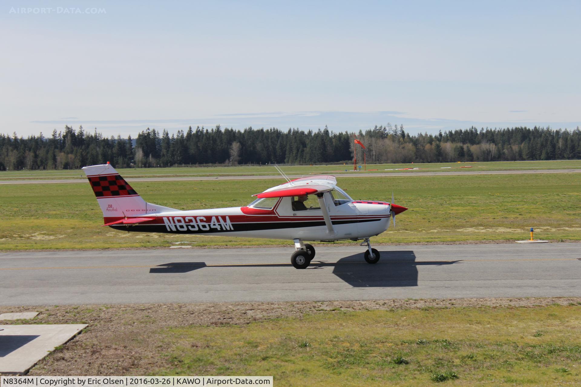 N8364M, 1969 Cessna A150K Aerobat C/N A15000064, Cessna 150 taxing by a restaurant at the Arlington airport.