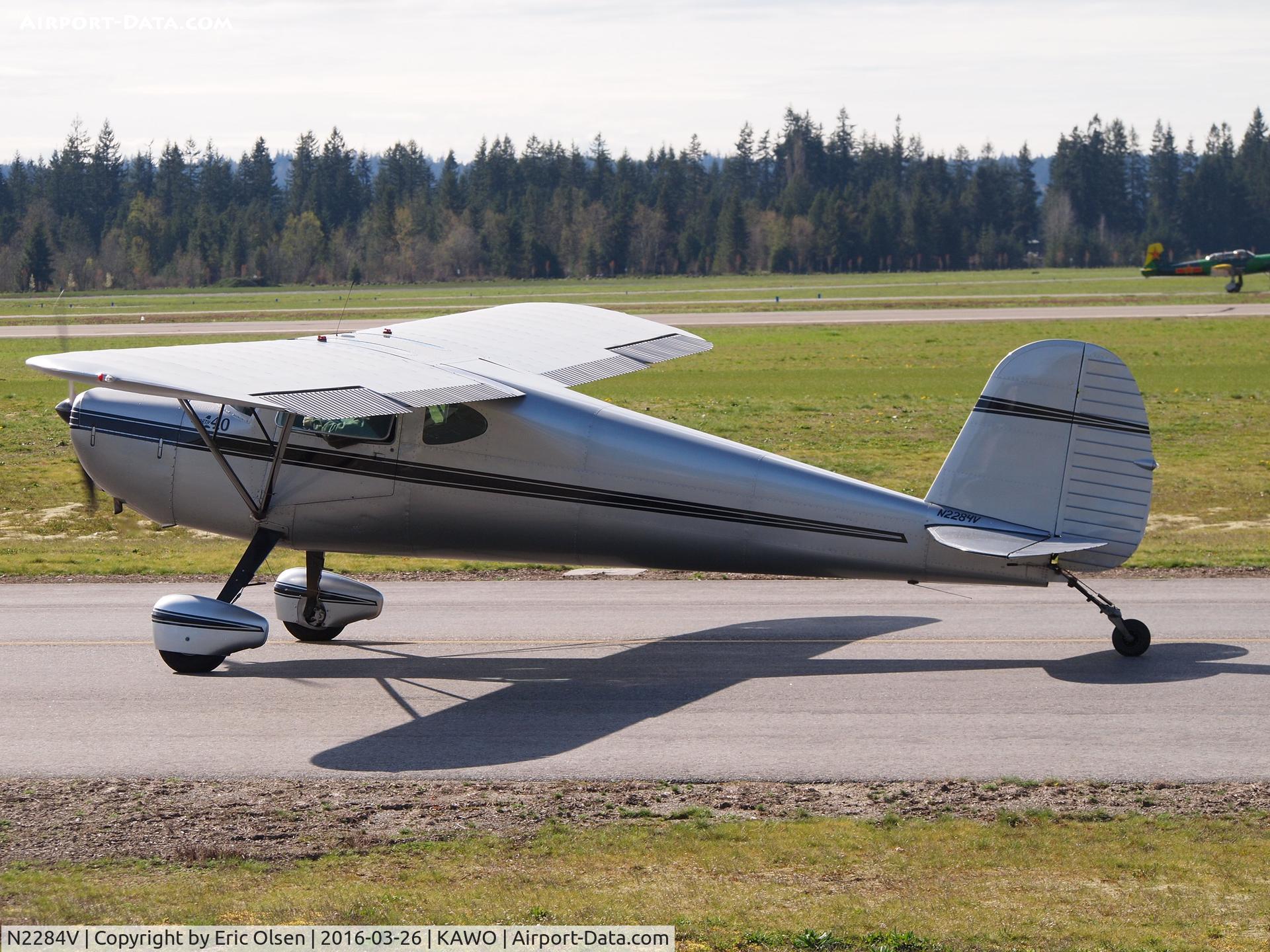 N2284V, 1948 Cessna 140 C/N 14514, Cessna 140 taxing by a restaurant at Arlington