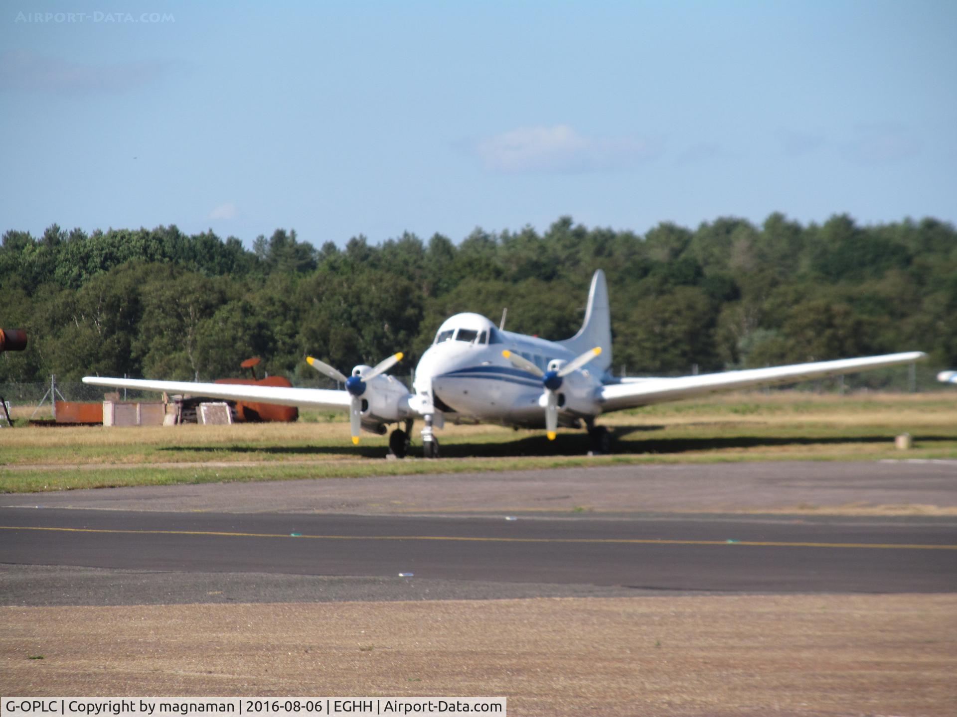 G-OPLC, 1948 De Havilland DH-104 Dove 8 C/N 04212, across apron shot in heat haze