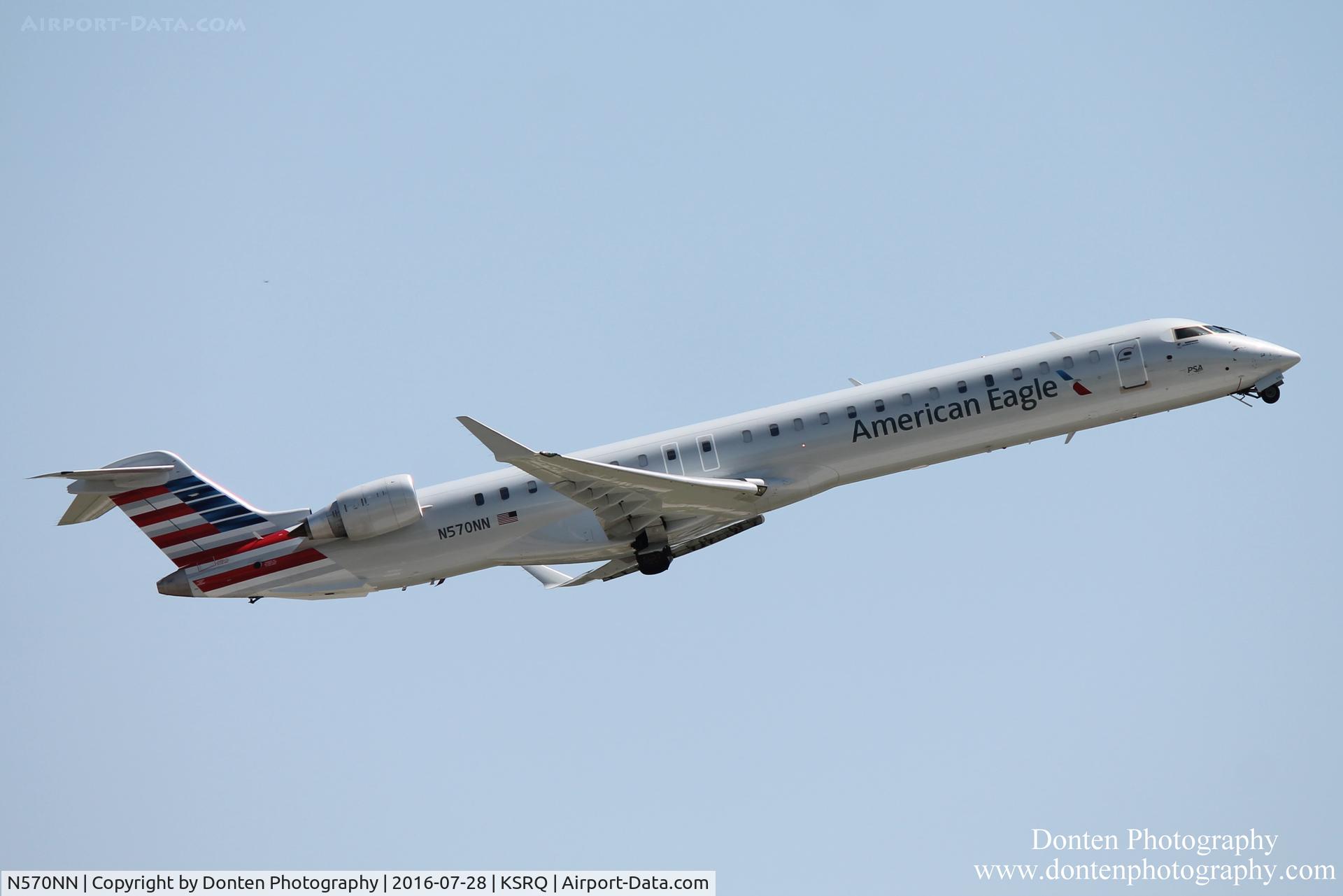 N570NN, 2015 Bombardier CRJ-900 (CL-600-2D24) C/N 15357, American Flight 5139 operated by PSA (N570NN) departs Sarasota-Bradenton International Airport enroute to Charlotte-Douglas International Airport