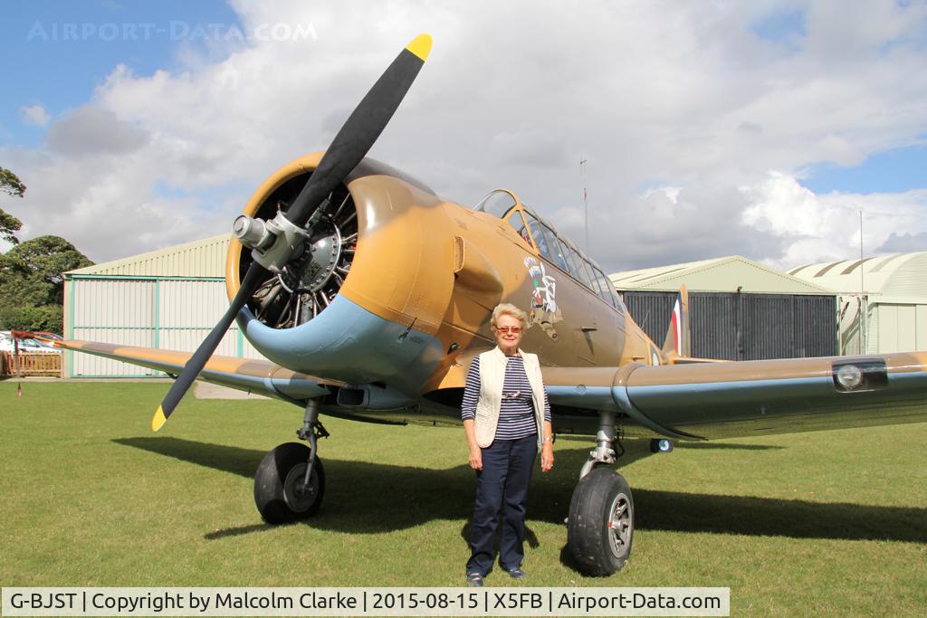 G-BJST, 1953 Canadian Car & Foundry T-6H Harvard Mk.4M C/N 14A-2429, Canadian Car & Foundry T-6H Harvard Mk4M with airfield owner Beryl Morgan, Fishburn Airfield, August 15th 2015.