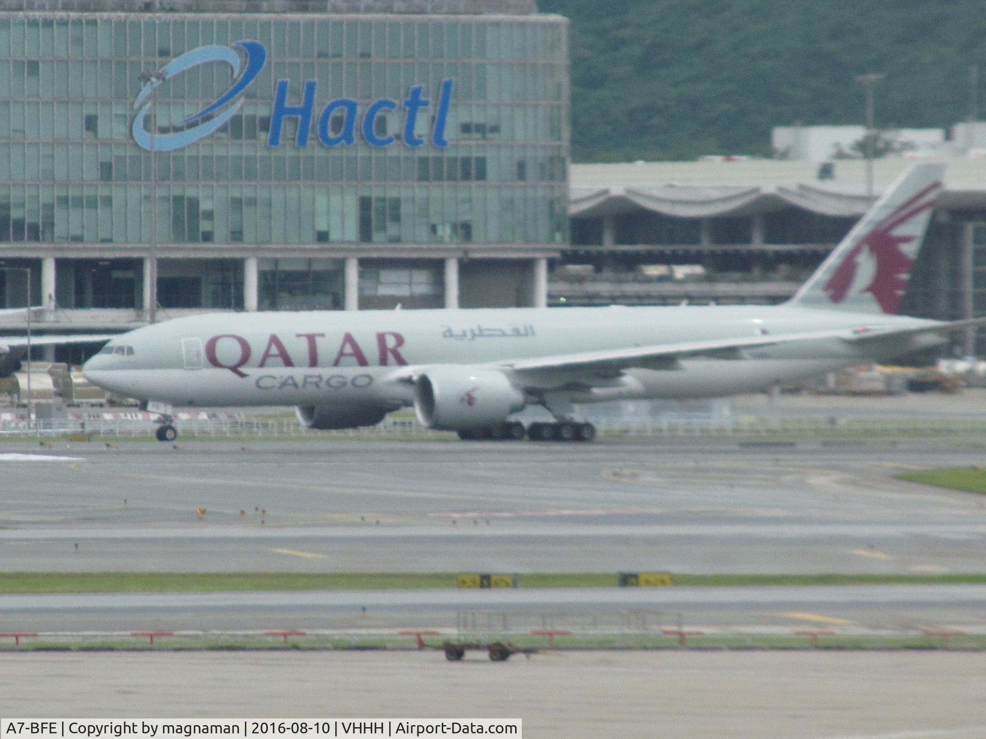 A7-BFE, 2013 Boeing 777-FDZ C/N 39644, long range through glass at HKG