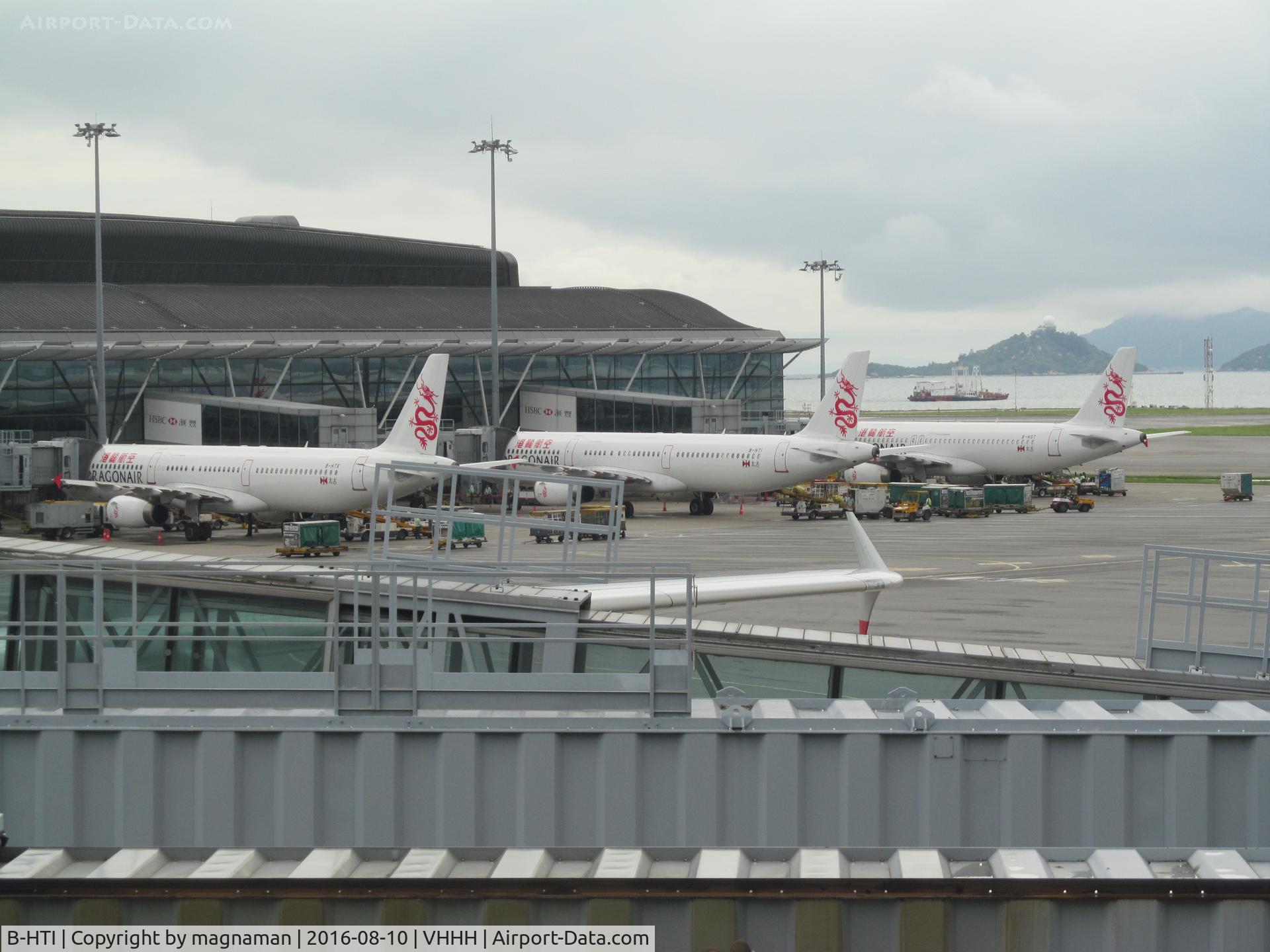 B-HTI, 2003 Airbus A321-231 C/N 2021, with two colleagues at HKG