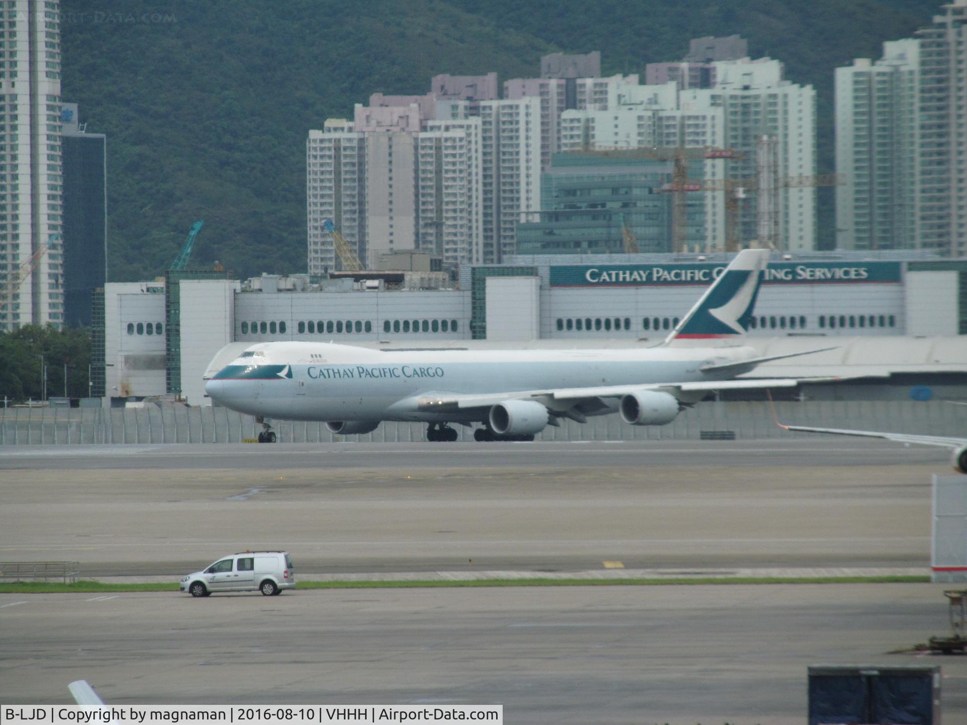 B-LJD, 2013 Boeing 747-867F/SCD C/N 39241, long shot across airport to departing 747