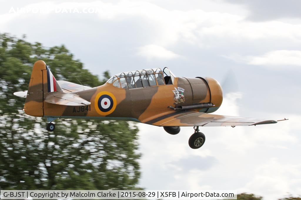 G-BJST, 1953 Canadian Car & Foundry T-6H Harvard Mk.4M C/N 14A-2429, Canadian Car & Foundry T-6H Harvard Mk4M. 'Wackey Wabbit' takes off from Fishburn Airfield, August 29th 2015.