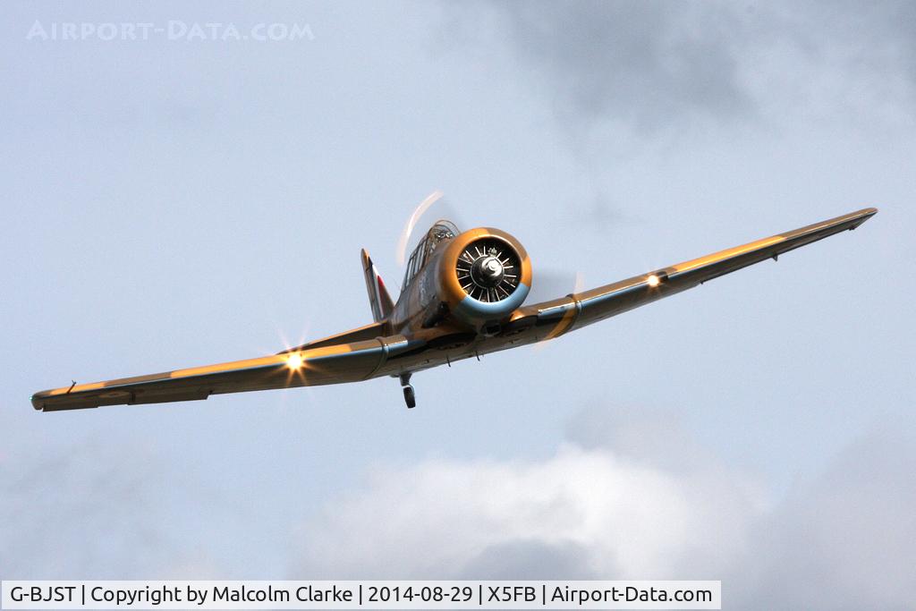 G-BJST, 1953 Canadian Car & Foundry T-6H Harvard Mk.4M C/N 14A-2429, Canadian Car & Foundry T-6H Harvard Mk4M. 'Wackey Wabbit' makes a runway pass at Fishburn Airfield, August 29th 2015.