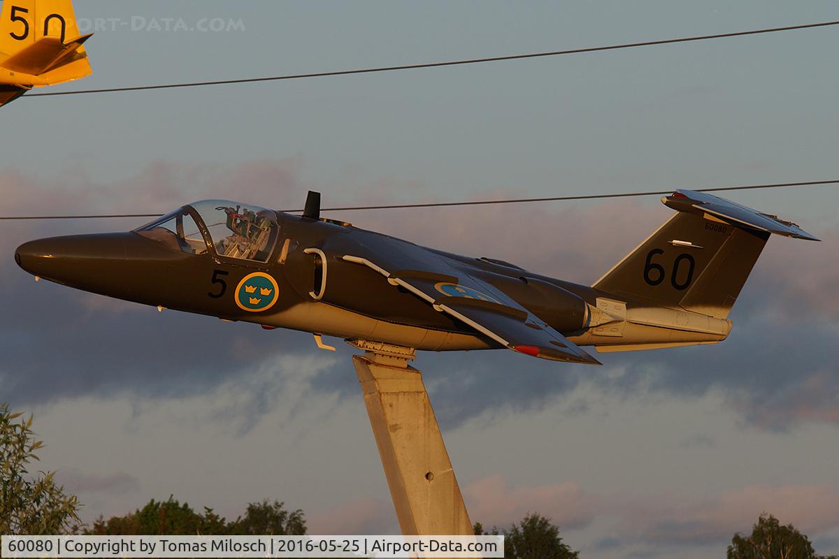 60080, Saab Sk.60B C/N 60.080, On the motorway E4 around Linköping you find several SAAB aircraft on display, most of them ex Swedish Air Force. 
This picture was taken was taken a few minutes before sunset.