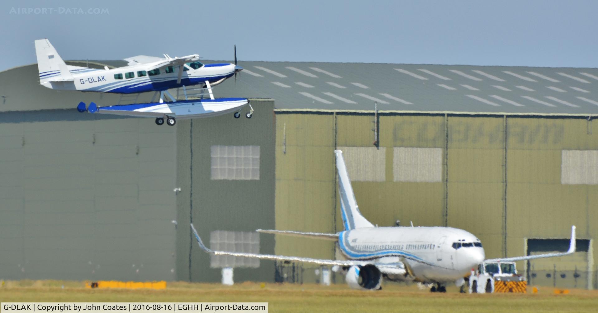 G-DLAK, 2001 Cessna 208 Caravan I C/N 20800340, Departing through the heat haze after repaint