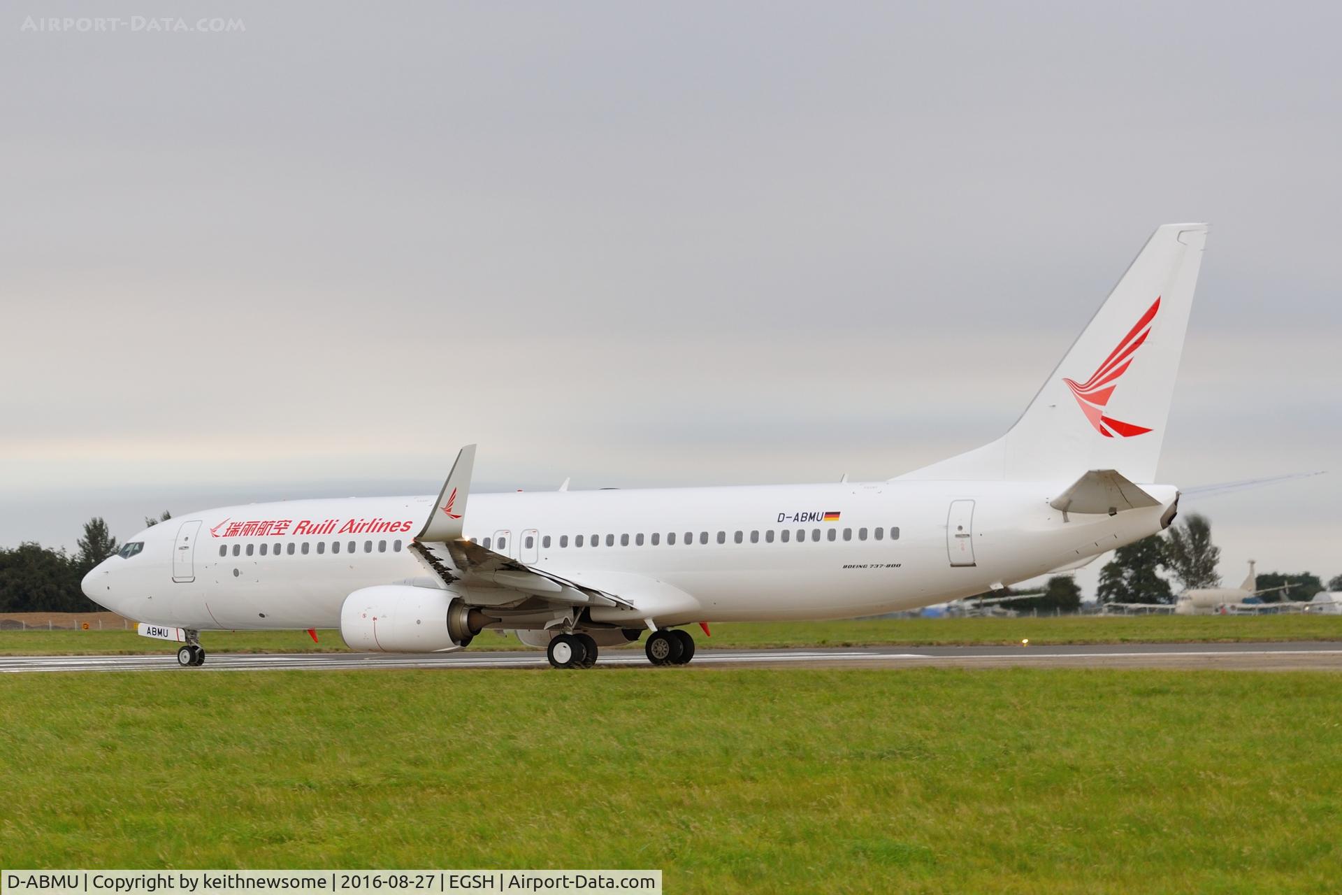 D-ABMU, 2013 Boeing 737-86J C/N 39384, Leaving Norwich in Ruili Airlines colour scheme.
