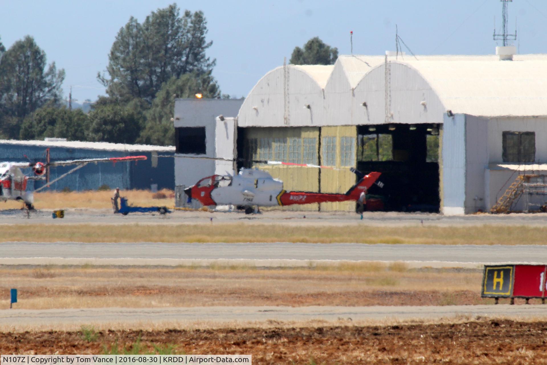 N107Z, 1983 Bell 209 (AH-IS Cobra) Firewatch Cobra C/N 22342, 1983 Bell 209 (AH-IS Cobra) Firewatch Cobra C/N 22342 at Redding being pushed back into the hangar.