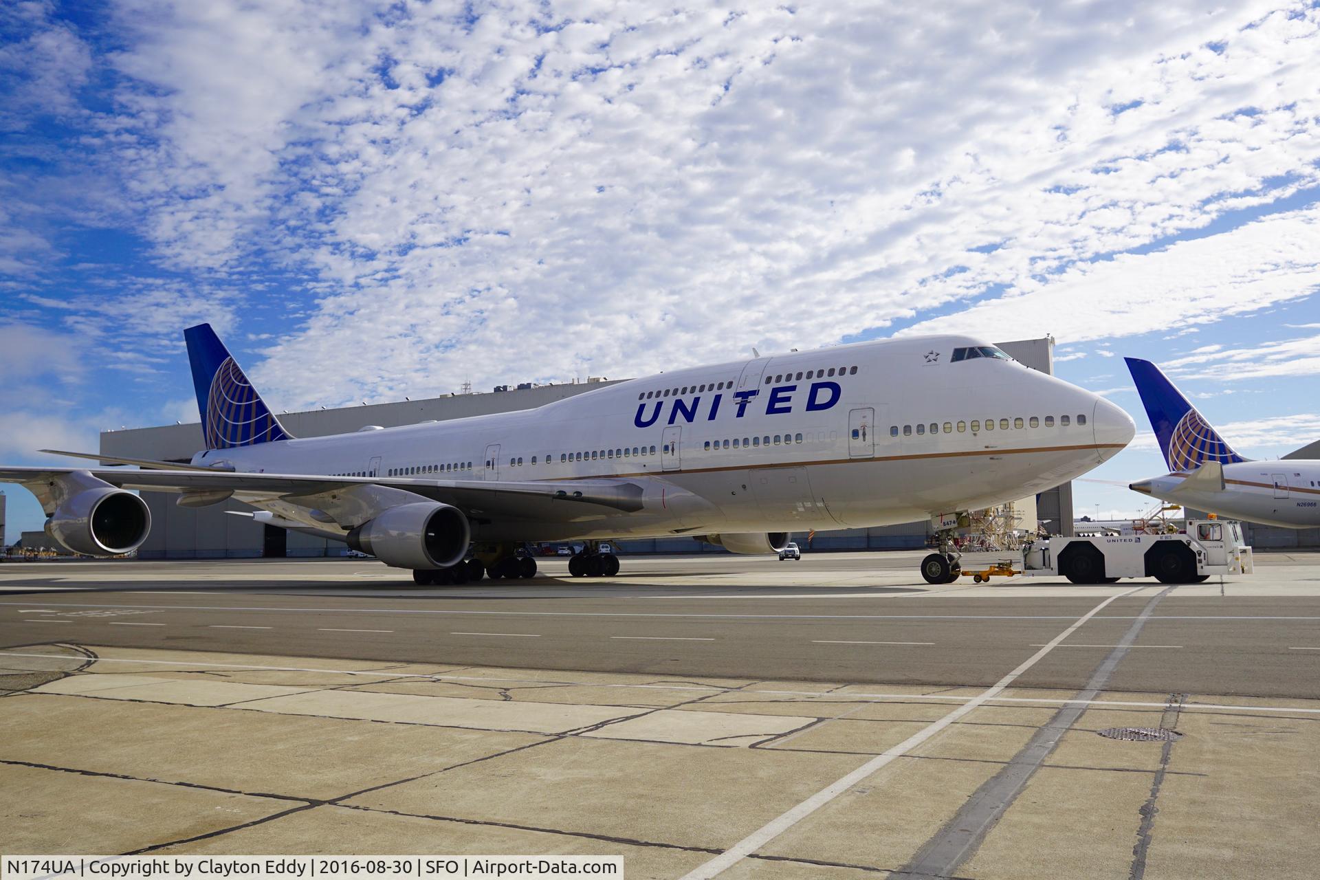 N174UA, 1990 Boeing 747-422 C/N 24381, N174UA being towed at SFO.