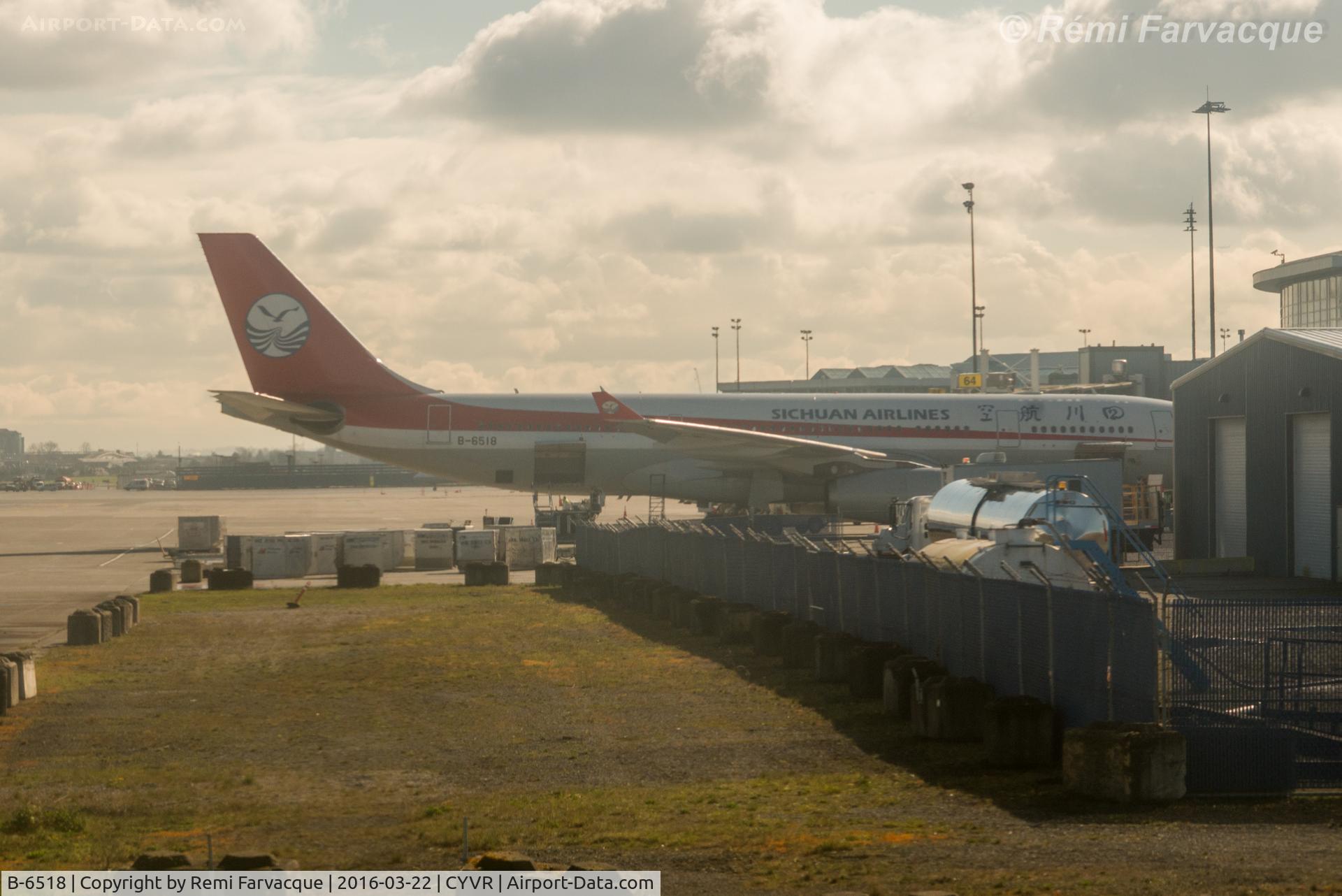 B-6518, 2010 Airbus A330-243 C/N 1082, Drive-by from another aircraft. Parked at International terminal.