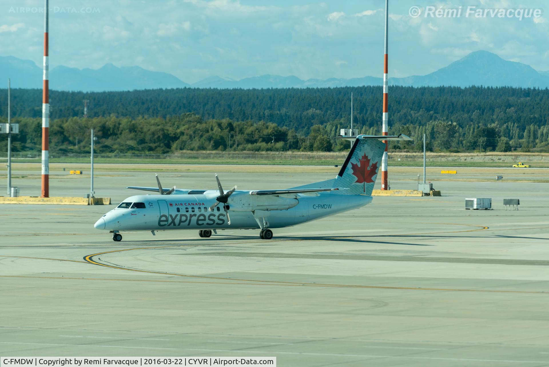C-FMDW, 1991 De Havilland Canada DHC-8-311 Dash 8 C/N 269, Taxiing to Domestic after landing on north runway.