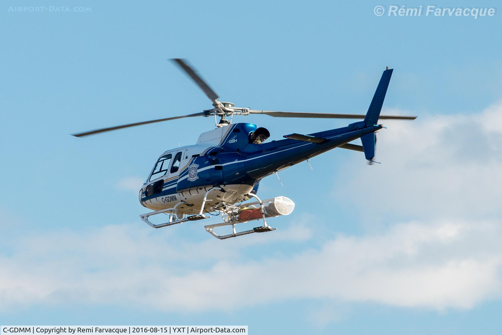 C-GDMM, 1997 Aerospatiale AS-350B-2 Ecureuil C/N 2980, Flying south over north part of main terminal area, to hangar.