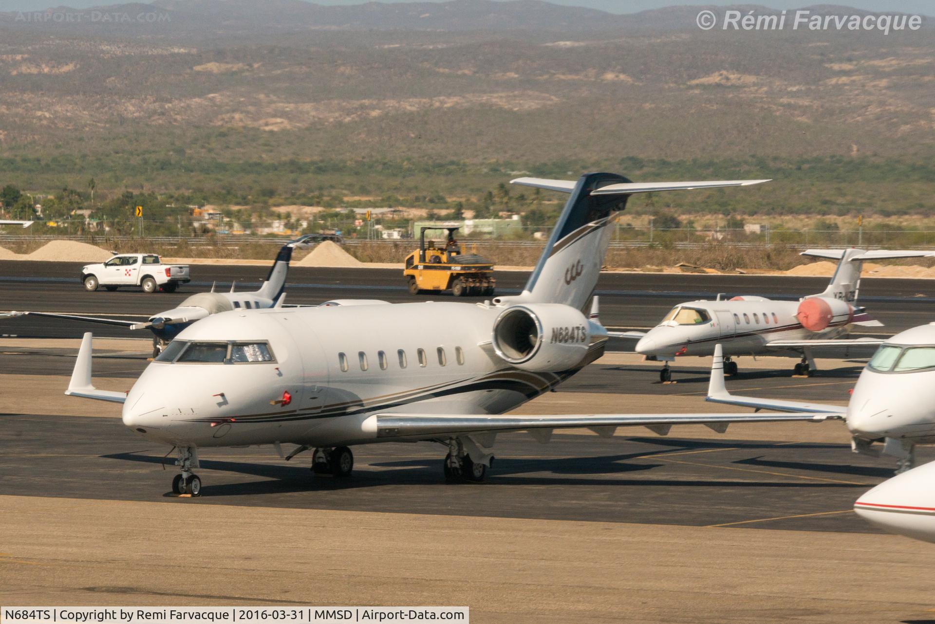N684TS, 2001 Bombardier Challenger 604 (CL-600-2B16) C/N 5484, Parked at north end of airport in private craft area. Photo taken from another aircraft.
