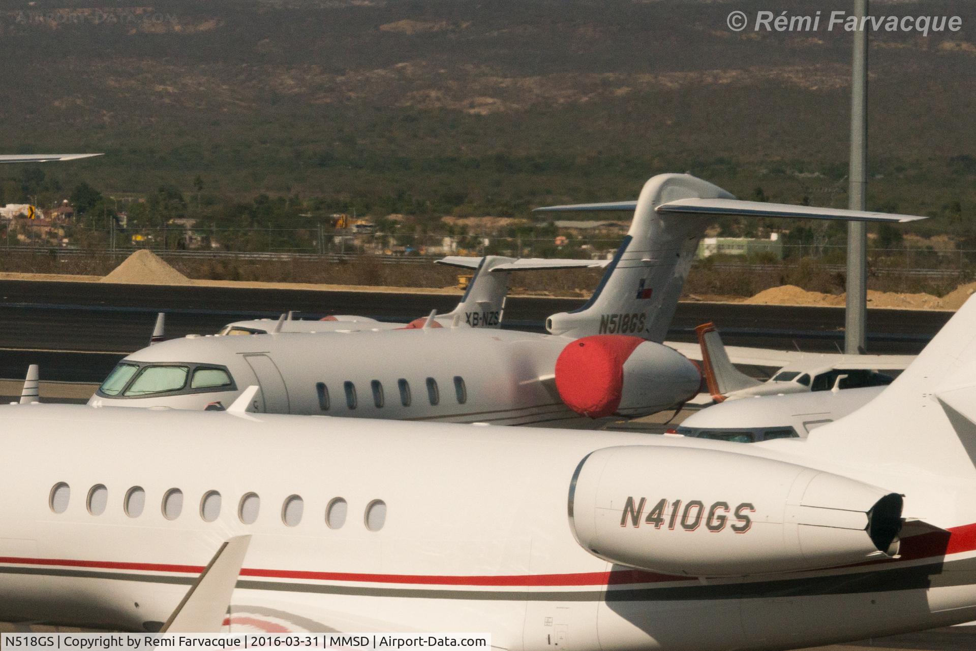 N518GS, 2006 Bombardier Challenger 300 (BD-100-1A10) C/N 20132, Parked north of main terminal building in private craft area. Photo shot from another aircraft.