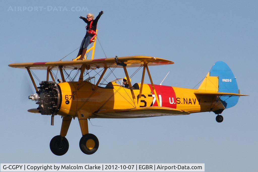G-CGPY, 1945 Boeing E75N1 C/N 75-5303, Boeing E75N1 on wing walking duties during the Hibernation Fly-In, Breighton Airfield, October 7th 2011.