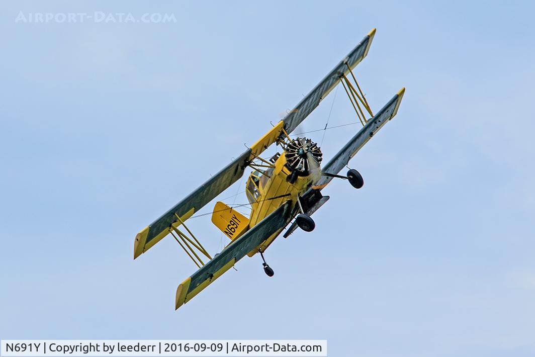 N691Y, 1964 Grumman G-164 C/N 242, Working a field near Millsboro, Delaware, the Ag Cat G-164 banks at the end of a run.