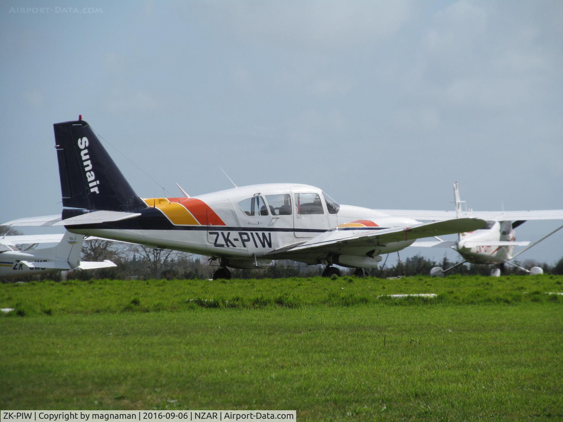 ZK-PIW, Piper PA-23-250 Aztec C/N 27-7305089, on grass at ardmore