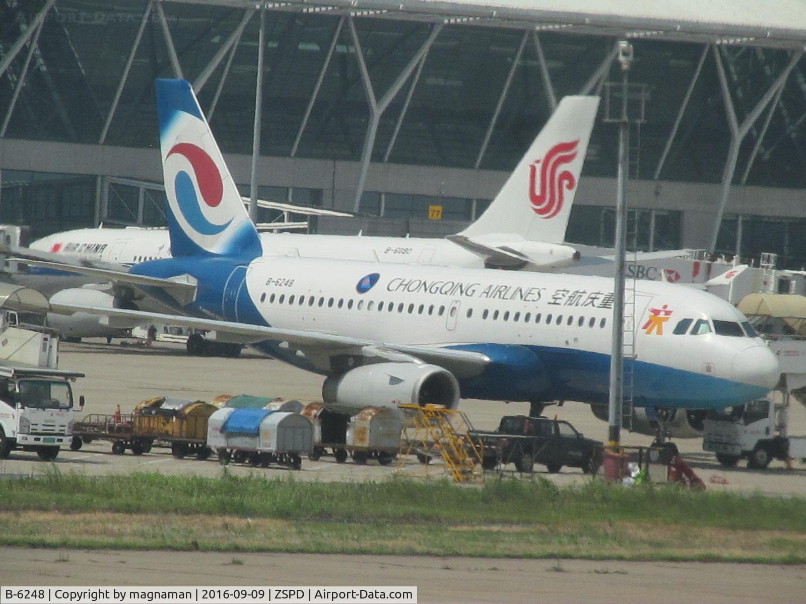 B-6248, Airbus A319-133 C/N 3901, on remote stand as we taxy by