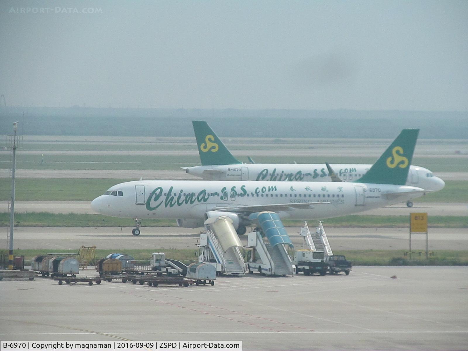 B-6970, 2012 Airbus A320-214 C/N 5403, with sister aircraft coming in as this one leaves