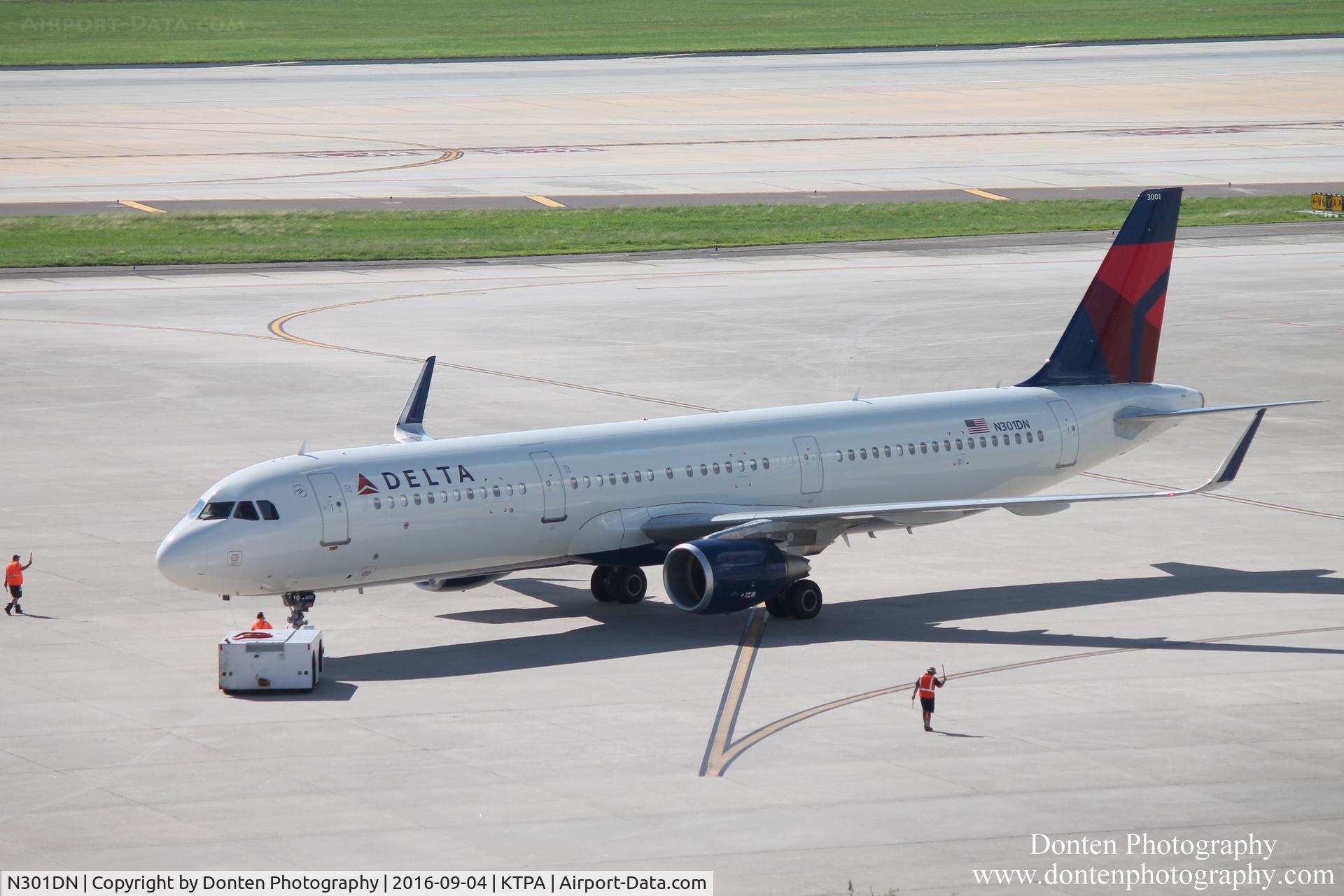 N301DN, 2016 Airbus A321-211 C/N 6923, Delta Flight 828 (N301DN) pushes back from the gate at Tampa International Airport prior to a flight to Hartsfield-Jackson Atlanta International Airport