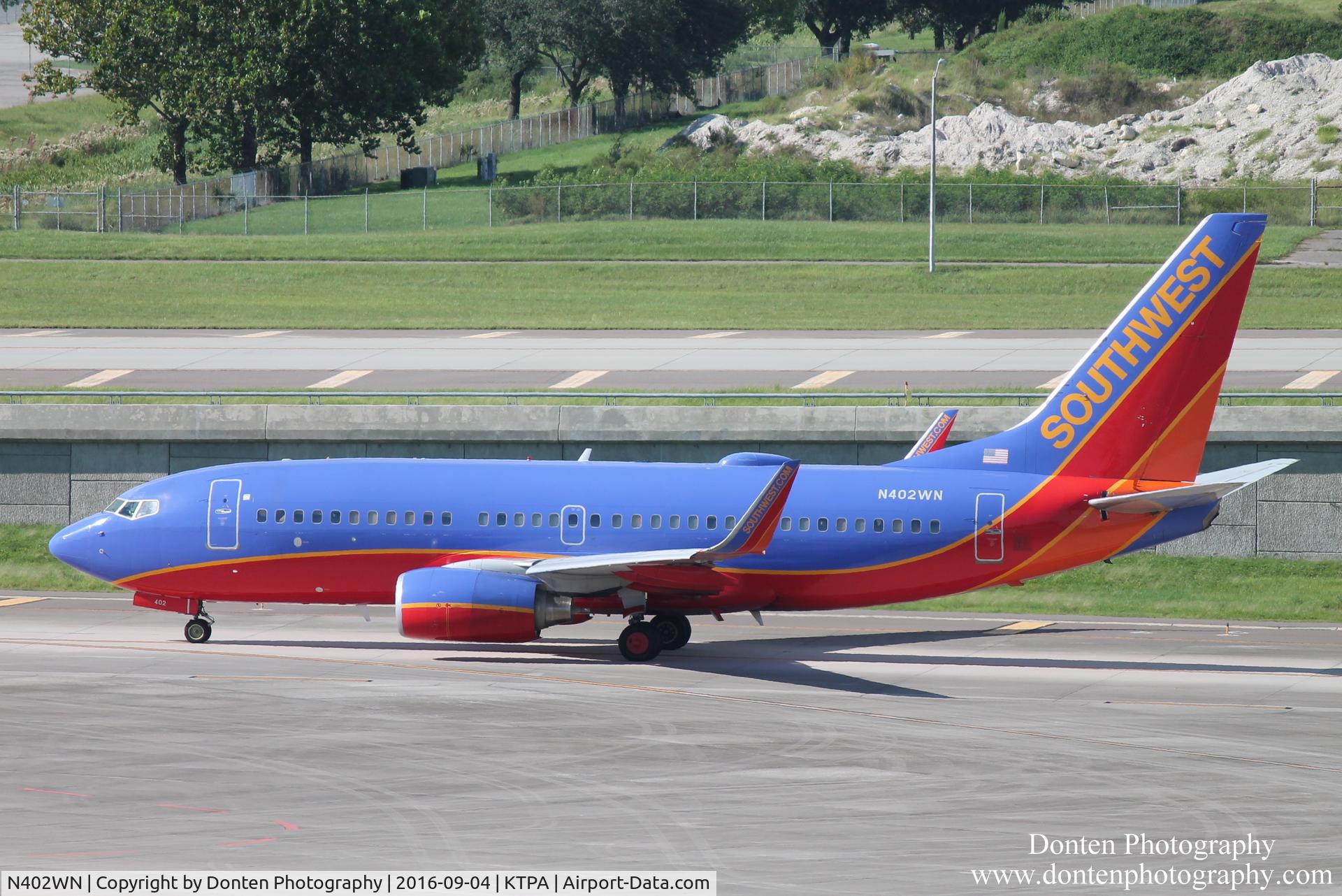 N402WN, 2001 Boeing 737-7H4 C/N 29814, Southwest Flight 588 (N402WN) taxis for departure at Tampa International Airport prior to flight to Louisville International Airport
