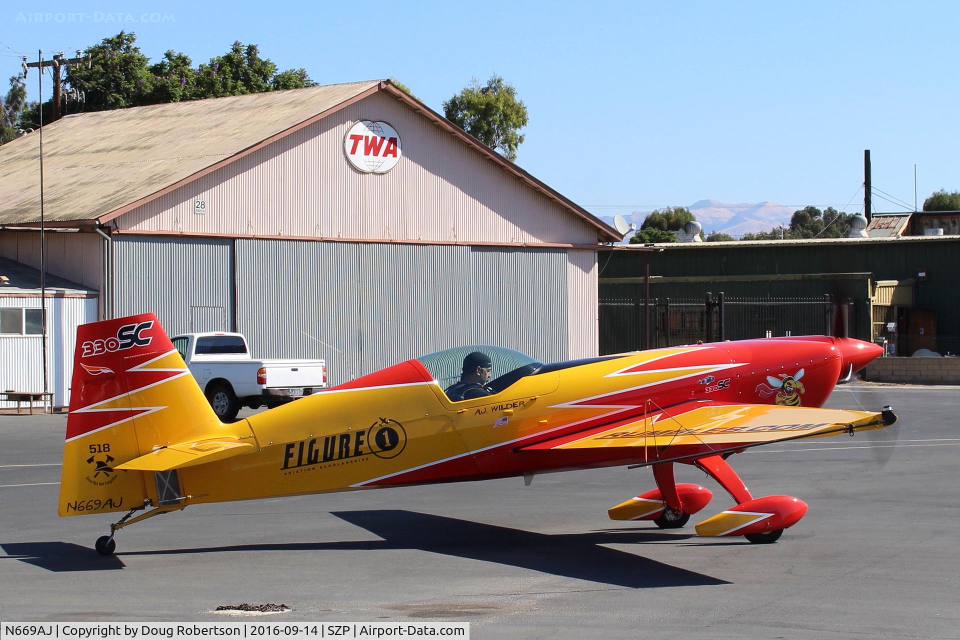 N669AJ, Extra EA-330SC C/N SC001E, Extraflugzeugproduktions EA330/SC, Lycoming IO-540-L1B5 300 HP modified to 330 Hp? Customized & modified, Experimental Class, Warmup engine for Rwy 22 takeoff, near it's hangar.