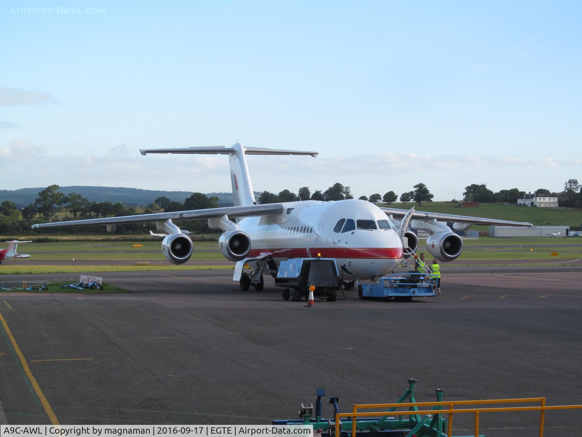 A9C-AWL, 2001 British Aerospace Avro 146-RJ100 C/N E3386, hiding between hangars at exeter