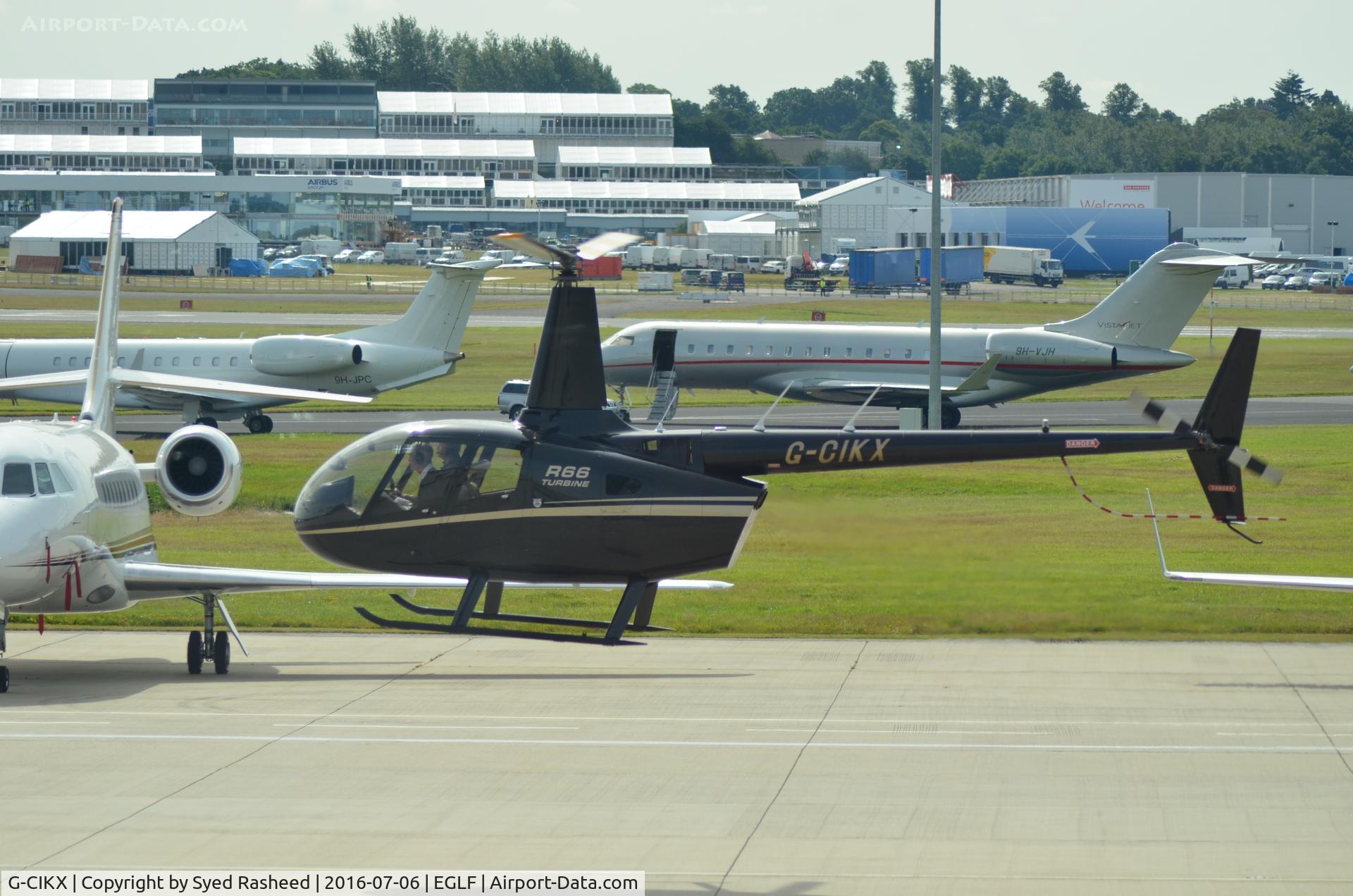 G-CIKX, 2014 Robinson R66 Turbine C/N 0555, Robinson R66 Turbine taxking to TAG parking for pax drop off
during Farnborough Air Show