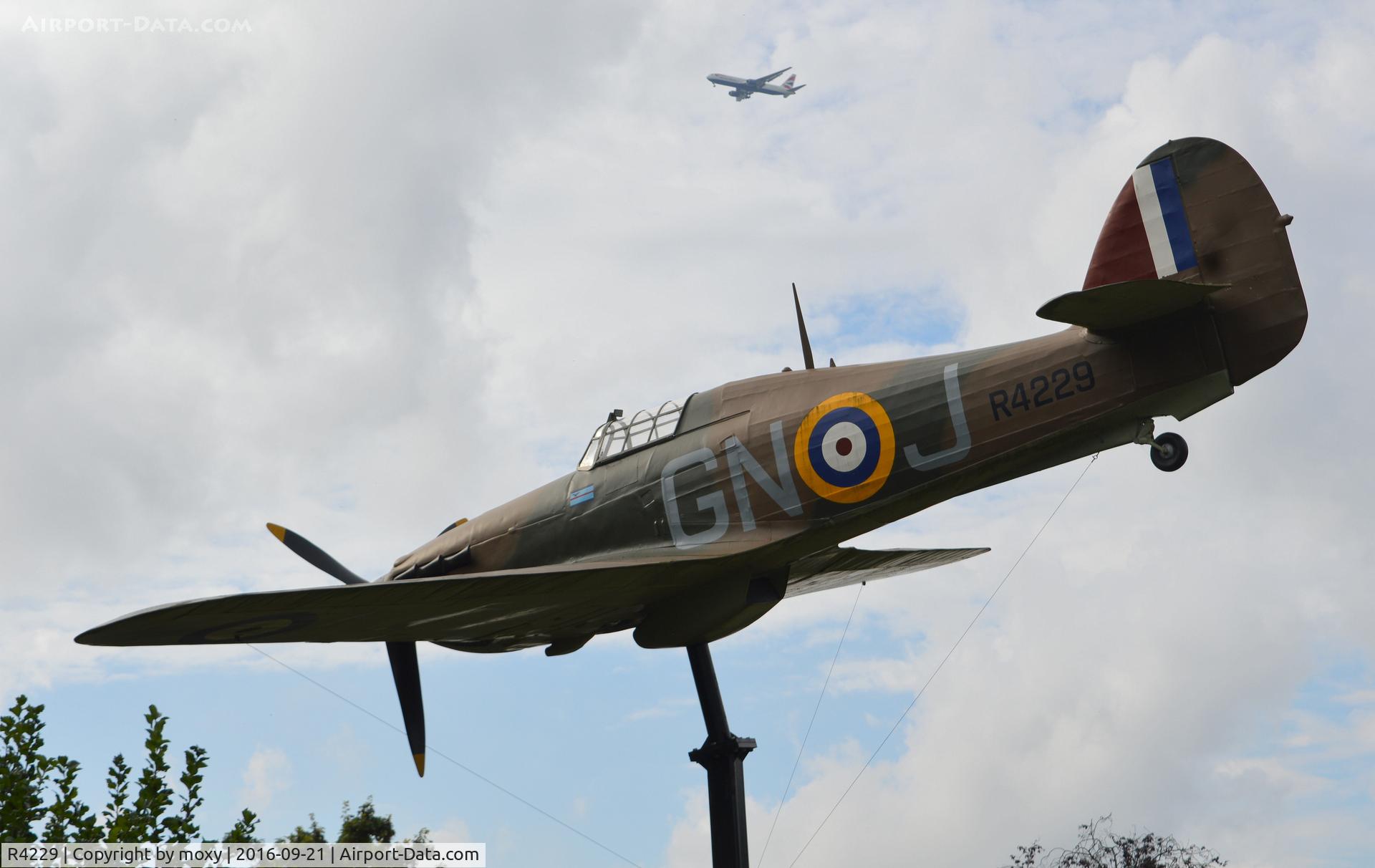 R4229, Hawker Hurricane 1 Replica C/N Not found, Hawker Hurricane Mk 1 replica in Alexander Gardens, Windsor, Berkshire. A memorial to the designer Sir Sidney Camm who was a Windsor resident. The markings are those of Squadron Leader John Grandy, Battle of Britain pilot who also spent time in Windsor.