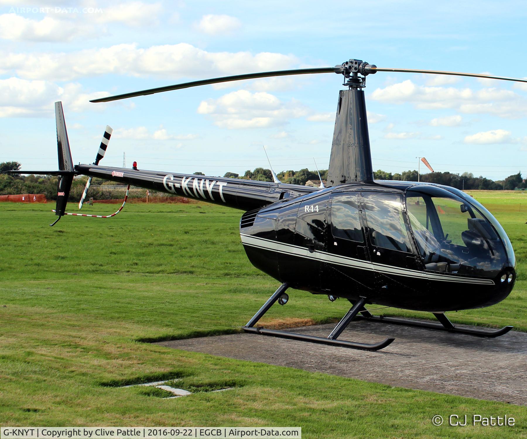 G-KNYT, 2000 Robinson R44 Astro C/N 0723, At the City Airport Manchester,  Barton EGCB