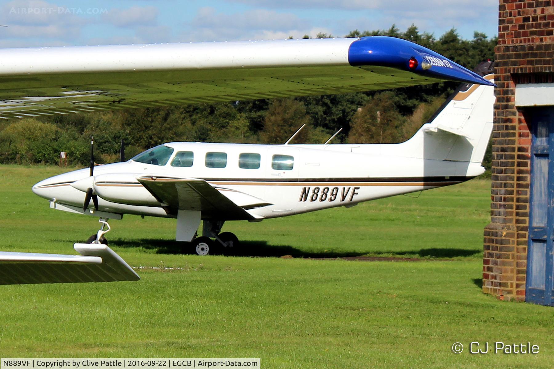 N889VF, 1982 Cessna T303 Crusader C/N T30300102, Partially obscured at the City Airport Manchester,  Barton EGCB