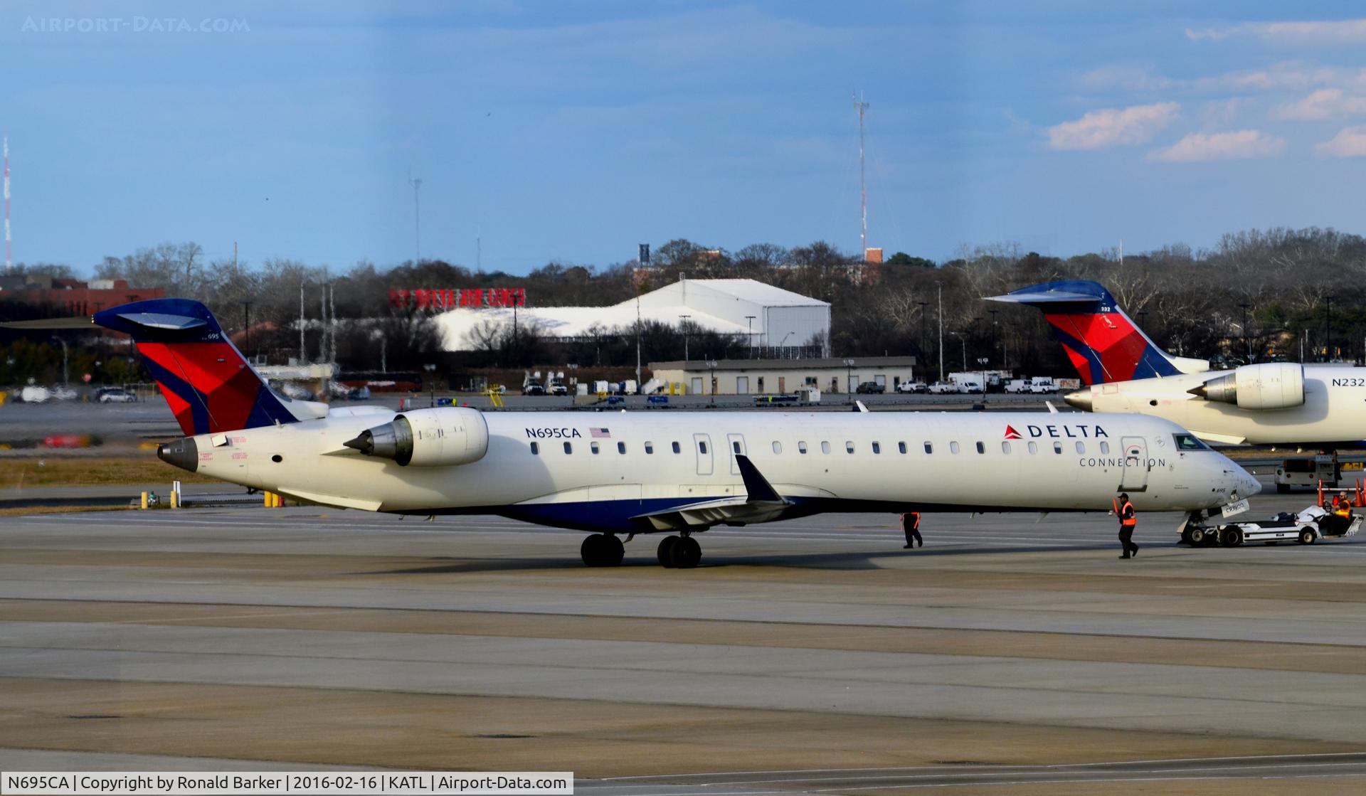 N695CA, 2006 Bombardier CRJ-900ER (CL-600-2D24) C/N 15097, Pushback Atlanta