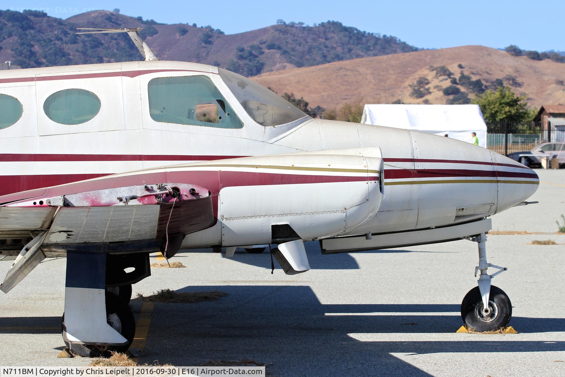 N711BM, 1966 Cessna 411 C/N 411-0220, Rotting 1966 Cessna 411 parked at its tie down, completely gutted with engines removed at South County Airport, San Martin, CA.