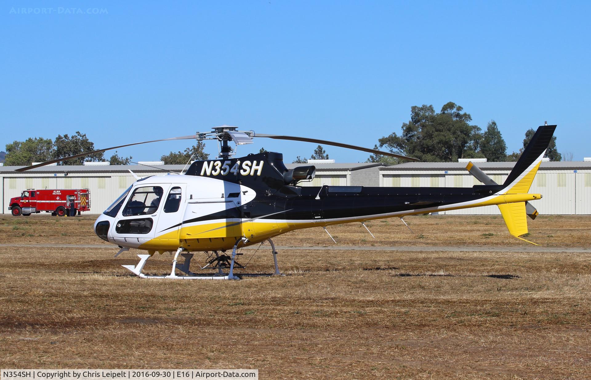 N354SH, 1998 Aerospatiale AS-350B-3 Ecureuil C/N 3131, Sycan Corp (Paso Robles, CA) 1998 Eurocopter AS-350B parked in the grass at South County Airport, San Martin, CA.