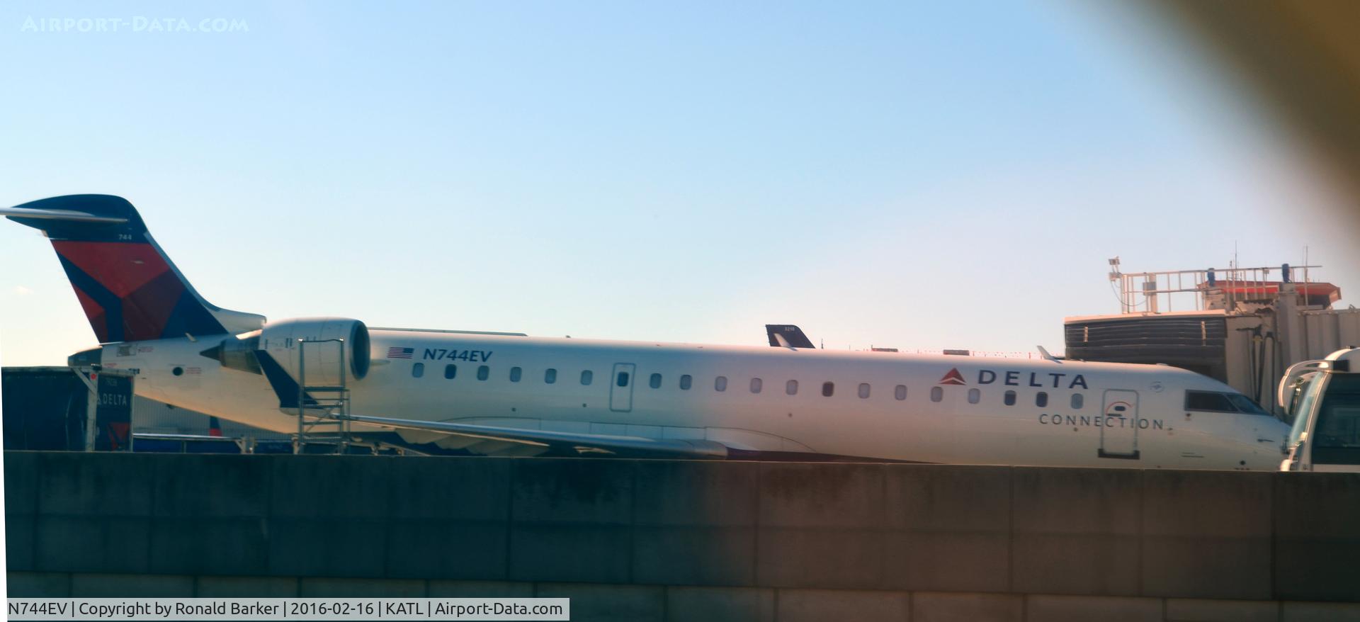 N744EV, 2004 Canadair CRJ-700 (CL-600-2C10) Regional Jet C/N 10157, At the gate ATL